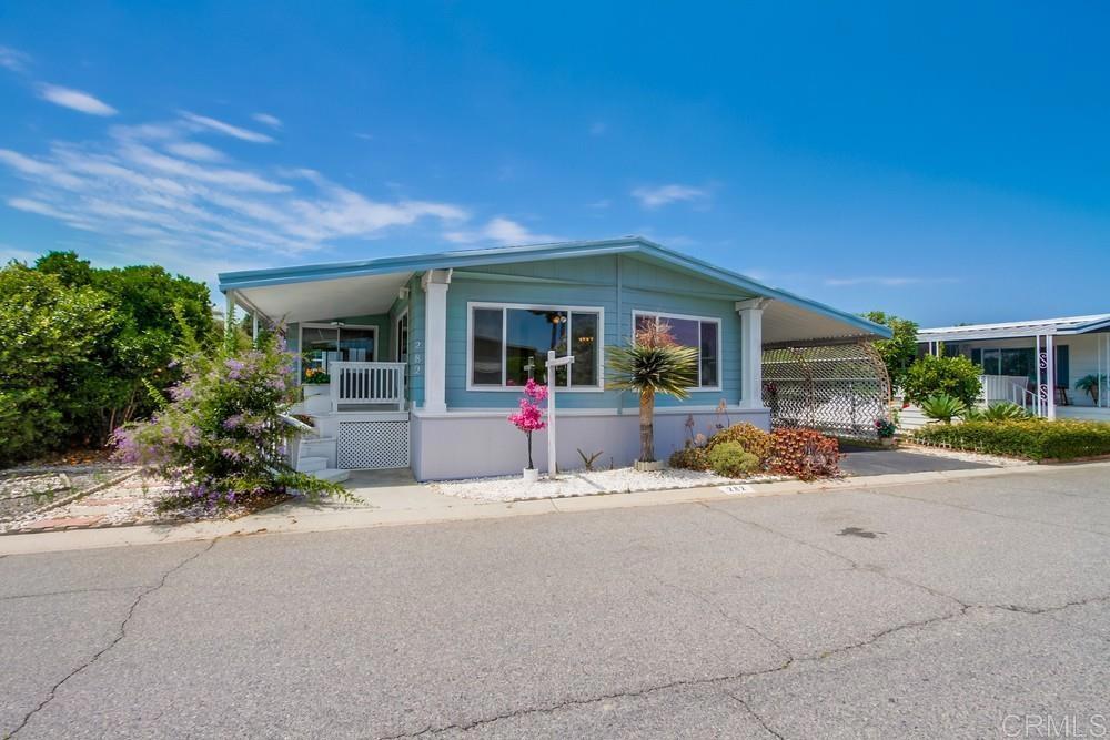 RENT CONTROL! NO PROPERTY TAX! Well cared for home with lots of upgrades. Fenced-in yard. Low maintenance yard. Lovely front porch to enjoy the ocean breezes. 2br 2bath. 1512sqft (63x24) plus large Calif Room attached that could be an art studio, craftroom, office, or 3rd bedroom. Master bedroom has massive walk in closet and dressing area. Upgraded composition roof. New AC and Furnace installed 2023. New Water Heater installed 2020. Most windows has been upgraded to doublepane. No carpet. Some rooms need upgraded flooring as noted in photos. Kitchen and both bathrooms have quartz countertops Space rent only $575 a month. Washer and Dryer remain. An operable golf cart goes with the home. Extrawide driveway. HUGE Tuffshed. 2 small pets welcome. Park is level and easy to walk around and ride bikes. LOTS of FUN Activities and great neighborhood camaraderie. 2 pools. 2clubhouses. 2 kitchens. Parties. Potlucks. Card rooms. Billiards. Crafts. Pickleball, Exercise Classes. Karaoke. Just outside the entrance of the park are grocery stores, banks, Starbucks, lots of restaurants, Walgreens, Post Office, library, Oceanside Police Station. Located about 4 miles from the ocean, harbor, charming pier, farmers markets, beach walks, street fairs, theaters, etc.