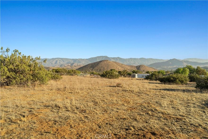 Discover the perfect opportunity to build your dream home in Acton. This lot offers all usable land with ample space for horses, room for your hobbies, or a private homestead. The property has two identified well sites, a completed perk test for septic, and fencing on three sides. Enjoy the wide-open landscape, peaceful surroundings, and sweeping sunset views!