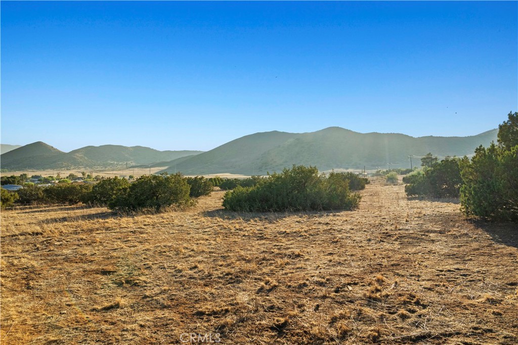 Discover the perfect opportunity to build your dream home in Acton. This lot offers all usable land with ample space for horses, room for your hobbies, or a private homestead. The property has two identified well sites, a completed perk test for septic, and fencing on three sides. Enjoy the wide-open landscape, peaceful surroundings, and sweeping sunset views!