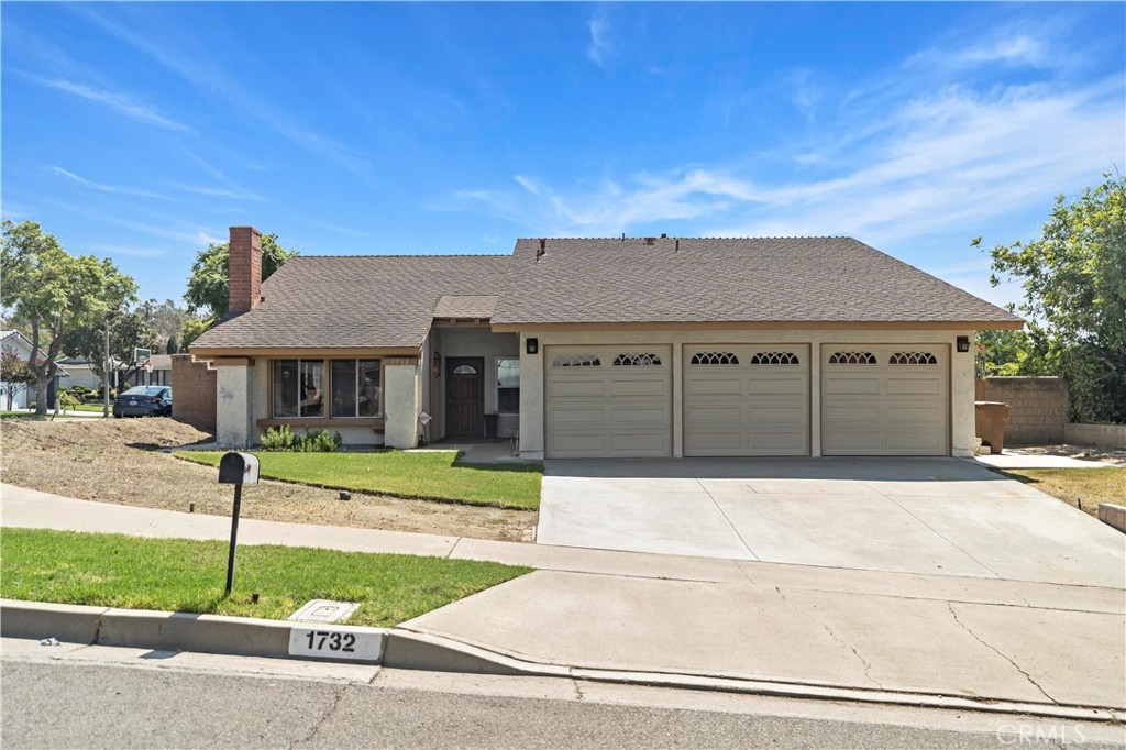 This beautifully maintained single-level home offers 1,740 sq. ft. of living space, seating on a generous 7,725 sq. ft. lot, featuring 4 spacious bedrooms and 2 updated bathrooms thoughtfully designed for comfort and functionality. The inviting living room showcases dramatic cathedral ceilings and modern laminate flooring, while the remodeled kitchen boasts quartz countertops and abundant cabinetry. A cozy family room provides the perfect space for gatherings with natural light streaming through sliding doors that open to a private backyard with a covered patio, vinyl fencing, and mature fruit trees. The remodeled master suite includes an upgraded bathroom, creating a relaxing retreat. A rare 3-car garage with overhead shelving, along with a long and wide driveway, offers excellent parking and storage options. Nestled in a quiet end-unit location near parks, Rolling Hills Elementary, Brea Mall, entertainment, and scenic trails, this home blends modern updates with timeless appeal in a highly desirable neighborhood.