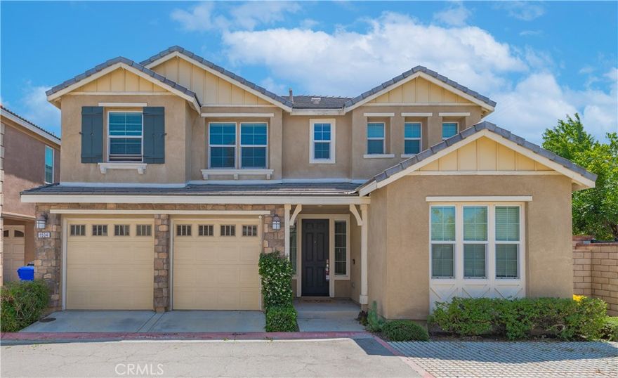 Discover modern living in this nearly new construction home, nestled within the highly desirable Spanish Trails community of Upland. Built in 2018, this thoughtfully designed residence offers a versatile floor plan to suit a variety of lifestyles. The main level is graced with durable laminate flooring and features a convenient downstairs bedroom and a full bathroom, perfect for guests or multigenerational living. The heart of the home is a gourmet kitchen, complete with ample cabinetry and granite countertops. A unique and practical feature is the separate wok kitchen, ingeniously designed to contain the aromas of cooking, ensuring the rest of the home remains fresh.

Upstairs, you will find a serene retreat with three additional bedrooms and two full bathrooms, providing ample space for family and visitors. The convenience of an upstairs laundry room adds to the home's practical appeal. All bedrooms are comfortably carpeted, creating a cozy atmosphere. The community itself extends your living space with amenities such as a BBQ grill, picnic tables, a basketball court, and outdoor fitness equipment.

The property’s prime location offers an abundance of recreational opportunities. Just across the street, Greenbelt Park unfolds with its playgrounds, baseball diamonds, picnic areas, and lush, tree-covered walking trails. This home provides easy access to a wide array of shopping, dining, and entertainment options, including the historic Claremont Packing House and the popular Victoria Gardens. Proximity to major transportation corridors, including the 210, 10, 15, and 57 freeways, ensures a convenient commute throughout the region.