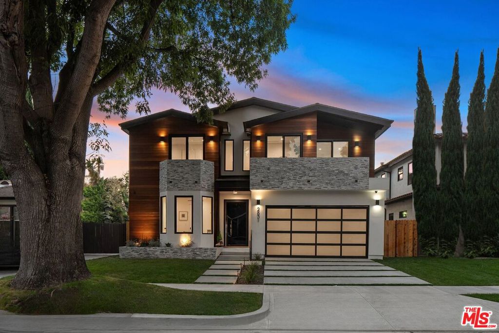 This exquisite 5-bedroom, 7-bath contemporary masterpiece in Beverlywood's exclusive HOA with 24-hour armed security patrols, blends high quality craftsmanship with modern luxury. This newly built estate offers a large sparkling pool, expansive grassy yard, and ficus trees that will only grow more mature and add even greater privacy. Inside, wide-plank white oak floors, custom millwork, and designer finishes elevate every space. The open-concept design, with disappearing Fleetwood sliding glass doors, seamlessly connects the interior to a private backyard oasis featuring a sunlit patio and built-in gas line for outdoor cooking. The chef's kitchen shines with Sub-Zero and Wolf appliances, white oak cabinetry, an oversized island, walk-in pantry, and a wine fridge with custom shelving. Each spacious bedroom includes an en-suite bathroom and bespoke closet, with all four upstairs bedrooms opening to private balconies. The primary suite stuns with a spa-like bath, dual vanities, soaking tub, oversized shower, and a tailored walk-in closet. Additional highlights include a sunlit office, Control4 smart home automation, LED lighting, a fully fenced yard with ficus hedges, and lush landscaping with irrigation. A rare gem where luxury and comfort converge in the heart of Beverlywood.