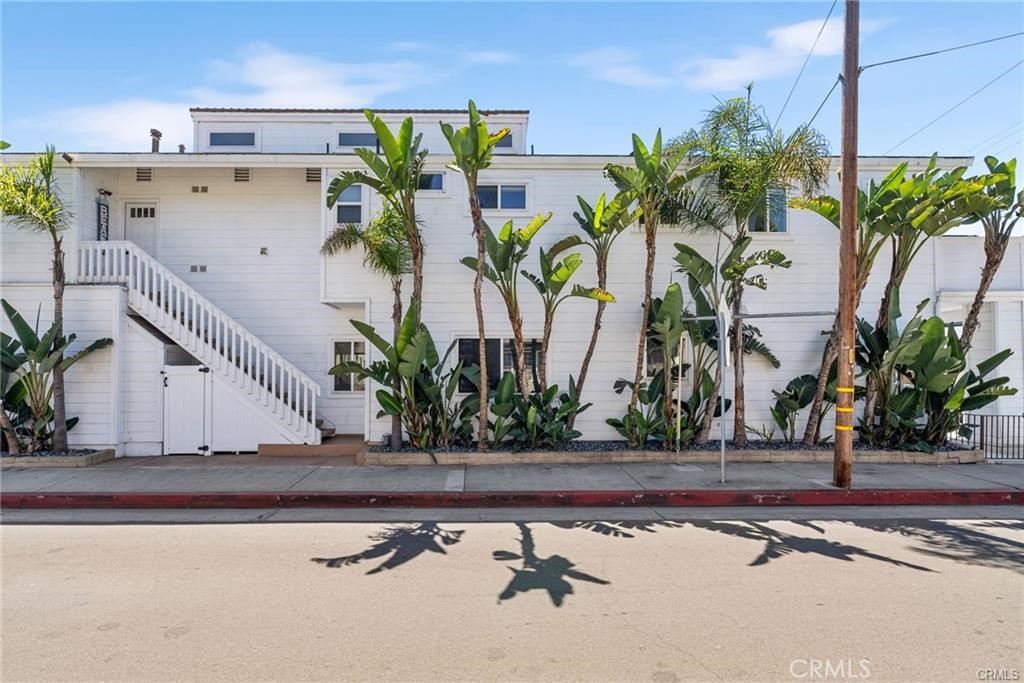 Modern Coastal Triplex in Lido Marina Village | Income Potential Up to $18,000/Month Welcome to 410 Clubhouse Avenue, an exceptional modern
coastal triplex located in the heart of Newport Beach’s exclusive Lido Marina Village. Just moments from the marina, beach, and renowned
hotspots like Nobu, Mayor’s Table, and Lido House, this property blends prime location with strong investment potential—offering projected rental
income of up to $18,000 per month. Meticulously upgraded throughout, this triplex features approximately 2,700 square feet of living space across
three distinct units, each with private entry and thoughtfully curated interiors designed for comfort, function, and style. The upstairs unit offers 3
bedrooms and 2 bathrooms, highlighted by vaulted ceilings and a large private balcony ideal for entertaining or sunset views. The main-level unit
features 2 bedrooms and 2 bathrooms with an open-concept living area and fireplace. The third unit is a charming studio with a private entrance
and full bathroom, perfect for rental or extended guest stays. Each unit boasts a gourmet kitchen outfitted with premium stainless steel
appliances, custom cabinetry, and sleek quartz countertops. Additional upgrades include wide-plank wood flooring, spa-inspired bathrooms, and
elegant designer finishes throughout. One of the most valuable features of this property is the inclusion of three separate utility meters - for each
unit. This setup maximizes rental efficiency, reduces landlord overhead, and offers flexibility for multi-tenant use. The property also offers four
parking spaces (including a 2-car garage and 2-car carport), along with peek-a-boo ocean views, a sun-filled private courtyard, and updated
systems throughout. Whether you're seeking a luxury beach residence with supplemental income, a family compound, or a high-performing
investment, 410 Clubhouse Avenue delivers versatility, elegance, and value in one of the most coveted coastal markets in Southern California.