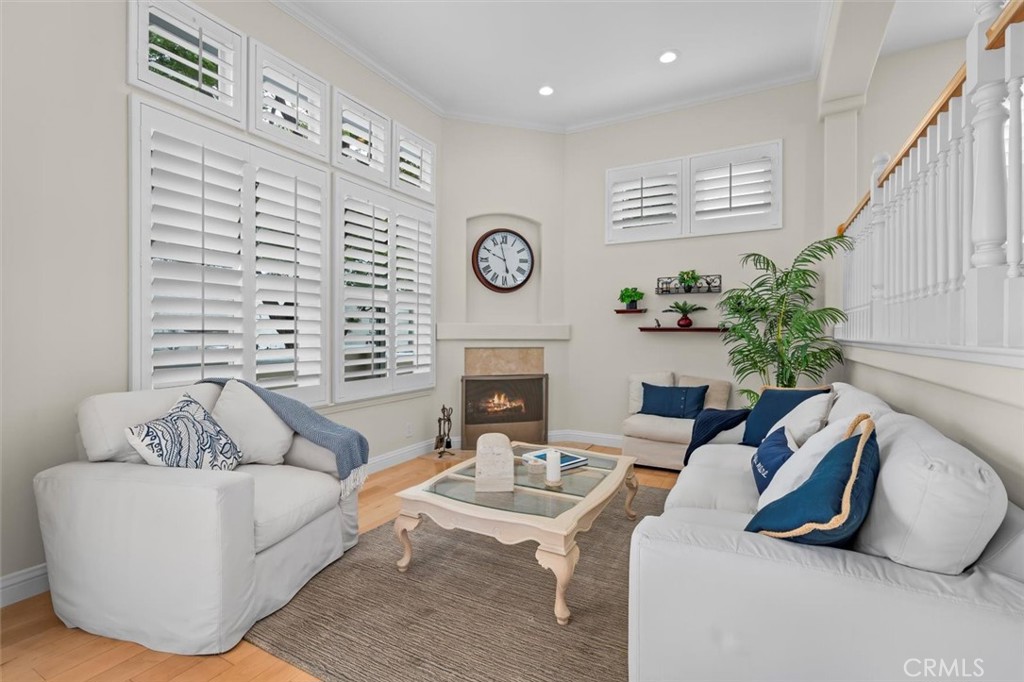 Step into one of the most coveted communities in beautiful historic downtown Torrance. Welcome to Brisas Del Mar, this immaculate, turnkey, end-unit townhome checks every box. Stylish, sun-filled, move-in ready, this home combines modern convenience with timeless architectural charm, all in a location that’s second to none. From the moment you enter you’ll feel the warmth of home. Inside, the living room welcomes you with soaring ceilings, crown molding, and a cozy fireplace, new wood floors flow through the main living areas, creating an inviting and elegant atmosphere. Just a few steps up is the open dining area and remodeled kitchen. Designed with function and style in mind, the kitchen is a true centerpiece with quartz countertops, a center island, stainless steel appliances, soft-close cabinetry, recessed lighting, a pantry and custom built-ins. There is also a breakfast nook which opens to a balcony, perfect for your morning coffee or weekend grilling. Also on this level: a stylishly updated powder room with a convenient laundry area. Upstairs, you’ll find three bedrooms and two full bathrooms. The generously sized primary suite is a peaceful retreat with vaulted ceilings, a walk-in closet, and a renovated en-suite bathroom featuring dual sinks. The 2nd bedroom also boasts tall ceilings. The 2nd and 3rd bedrooms are light-filled with charming views of the treetops — ideal for guests, a home office, or creative space. Additional features include: Central A/C and heat. Ceiling fans in every bedroom. Direct access 2-car garage. End-unit privacy and abundant natural light. But the real magic? The location, Historic Downtown Torrance feels like a charming neighborhood in Europe. Wake up and walk across the street to the iconic Torrance Bakery for buttery warm pastries and fresh-brewed coffee & cappuccino. Meet friends for brunch at Clutch & Coffee, toast to good times at Red Car Brewery, and enjoy dinner at Madres or The Local Kitchen. There is so much here, all within walking distance. You'll love strolling the tree-lined streets, visiting vintage boutiques, working out at local fitness studios, and spending peaceful moments at El Prado Park. Homes rarely come up for sale in Brisas Del Mar, — and for good reason, people want to live here forever! This is more than a home; it’s a lifestyle. A chance to live in a walkable, vibrant community where every day feels like a little getaway. And, yes, this home is in the distinguished Torrance School District.