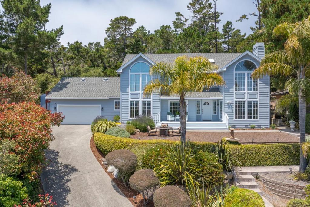Nestled at the end of a quiet cul-de-sac in Monterey's coveted Skyline Forest, this custom home offers peaceful forest living with filtered views of the Bay and surrounding hills. Featuring 3 bedrooms, 2.5 baths, and a beautifully renovated chef's kitchen with premium appliances and stone counters, the home blends sophistication with comfort. Walnut hardwood floors, soaring ceilings, and picture windows fill the interiors with warmth and natural light. The newly remodeled primary bathroom has a separate bathtub and shower with quartzite counters. Flexible living spaces include a cozy library, a spacious den with backyard access, a formal dining area ideal for entertaining, and a rec room/office. Enjoy the tranquility of the landscaped 0.27-acre lot, low-maintenance outdoor spaces, and a finished 2-car garage with ample storage. Perfectly positioned to enjoy world-class amenities just minutes away, from renowned golf courses and beaches in Pebble Beach, to Carmels fine dining, galleries, and boutiques, and Monterey's vibrant waterfront, aquarium, and cultural attractions. A rare opportunity for refined living in the heart of the Peninsula.