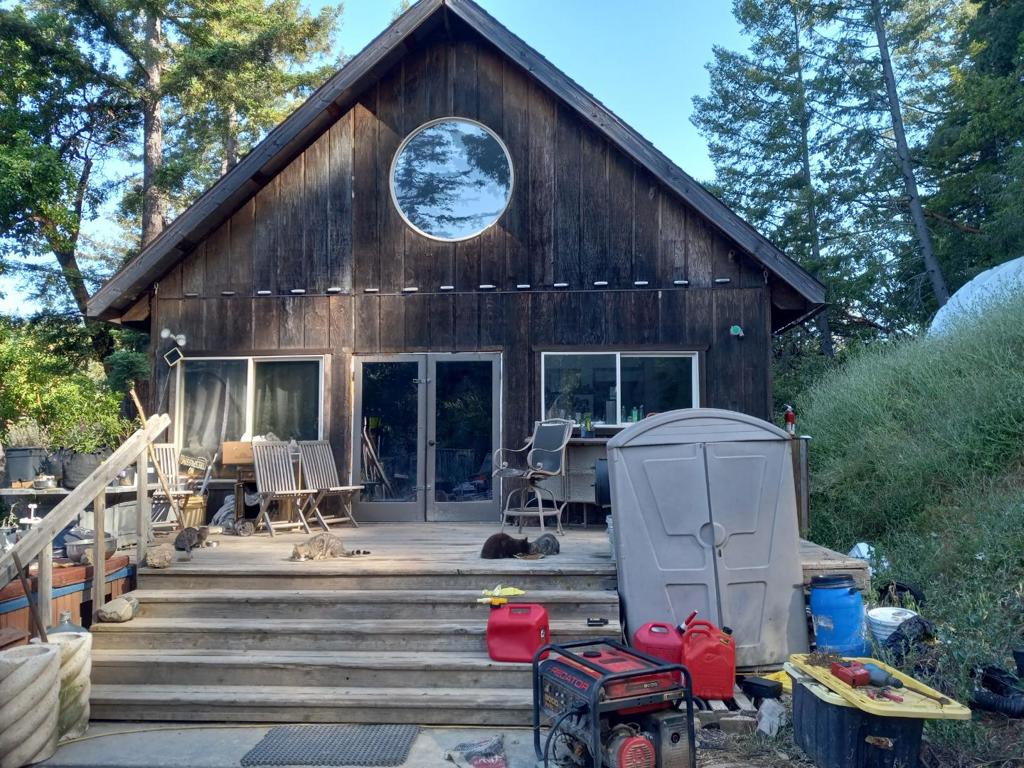 Beautiful, Peaceful 6 Acres with Septic and well on site. The Cabin offers Off Grid living at its best with potential for so much more.