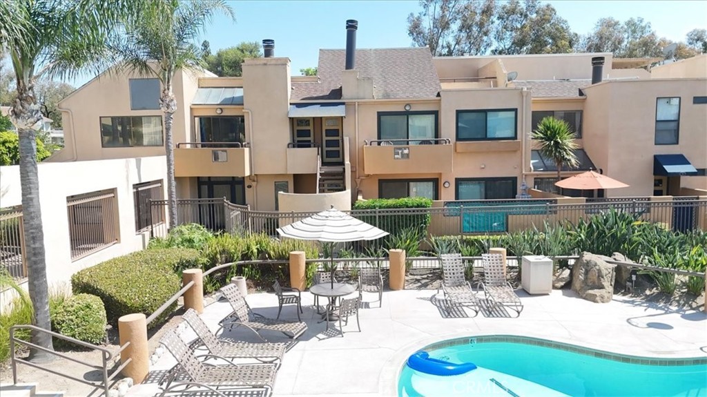 Great opportunity to own a condo in the prestigious city of Lake Forest. This upstairs end unit condo is located in a vibrant community with views of pool and open sky. Offers 2 bedrooms with a jack and jill bathroom, a utility room with stackable washer and dryer included, central AC, ample living room with a fireplace and sky light to enjoy the evening and sunsets views from your living room or private balcony. Award winning schools, walking distance to Rimgate Park.
The unit has 1 car garage and 1 parking space. Needs some cosmetic repairs.