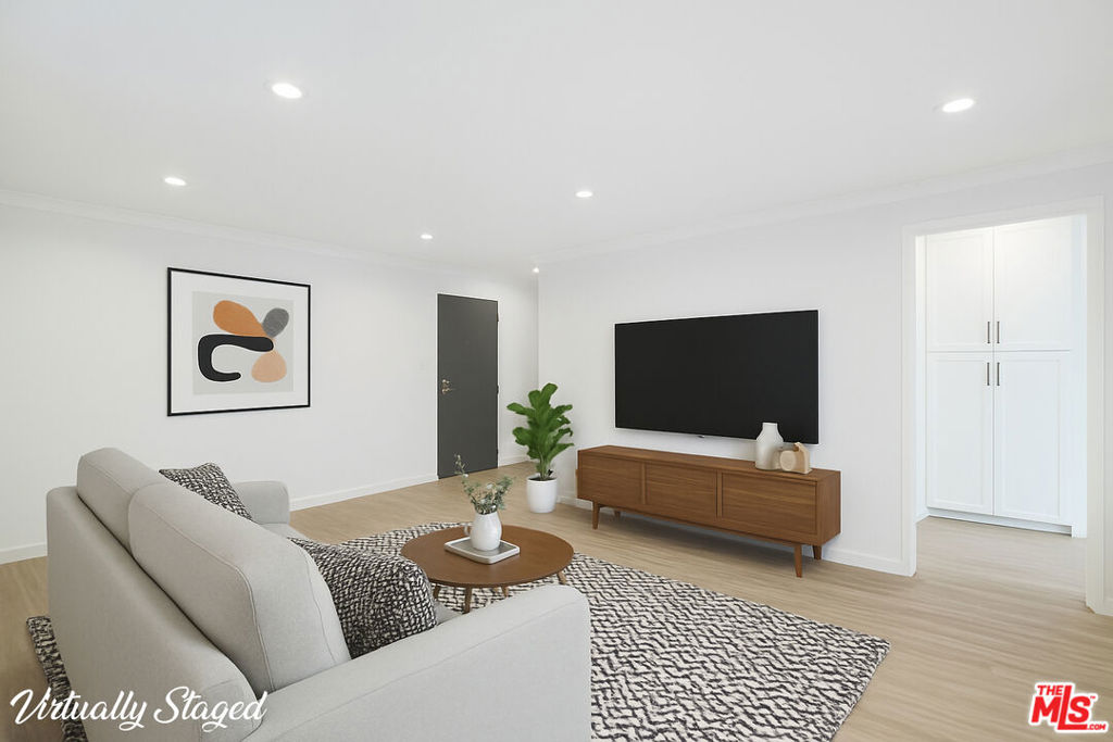 Beautifully bright, quiet corner unit with only one shared wall, perfectly located between Sunset Plaza and Santa Monica Blvd in West Hollywood. Up to date with spacious rooms that have light wood laminate flooring, recessed lighting, and good storage throughout. The kitchen has stainless steel appliances: refrigerator, dishwasher, range & microwave as well as beautiful stone counter-tops and white cabinets. The dining area sits between the kitchen & the balcony overlooking the courtyard. Generously proportioned master suite with large window & lots of natural light, ample closet space and a gorgeous bathroom of white marble, soaking tub & shower. The building boasts a lovely sunny pool with seating around, and a spectacular roof deck with 180 views of the City, both areas perfect to relax or entertain friends and family. There is one conveniently located parking spot and storage unit situated close to the entrance plus additional parking for guests. The area has the very best in entertainment, shopping, restaurants, bars & cafes, not to mention The Grove, the Beverly Center & Cedars Sinai hospital all close by.