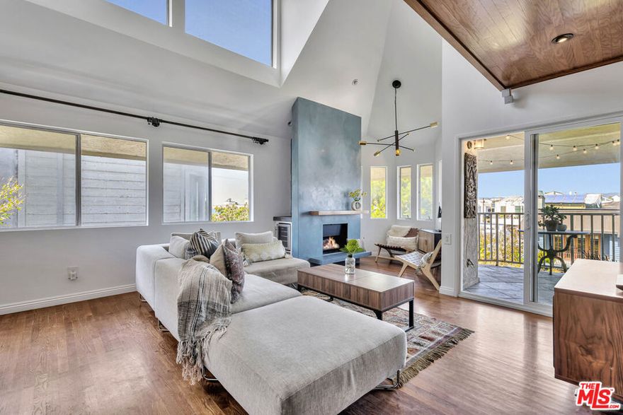 Are you dreaming of those long peaceful afternoons watching the boats sail in and out of the harbor? Let us introduce you to this spectacular 3-Story beach condo situated in the most coveted Marina del Rey Peninsula. This spacious & bright contemporary condo just feels like a home featuring ultra-luxurious designer materials combining modern & warm natural elements throughout. The main level offers an open floor plan concept, with high ceiling, new light fixtures and natural light throughout. A dream chef's kitchen offering top of the line appliances and a custom design bar counter perfect for entertaining, opens to the dining room and living room spaces with a finish Venetian plaster fireplace and balcony overlooking the ocean and the quiet neighborhood. The levels are divided by unique designer stairs featuring sailboat stainless steel cable rigging. The lower level features a primary ensuite bedroom with it's private balcony, walk-in closet and bathroom, as well as a secondary bedroom, bathroom and laundry area. The top floor features a bright and spacious loft, ideal for a 3rd bedroom or office space with it's own private roof deck, perfect for your relaxing evening; you will enjoy the ocean breeze, tranquility and most spectacular sunset views. Secured small private building, with direct access gated garage. Abundance of built-in storage throughout the home. Located on a quiet walkway that will lead you to the sand and to the end of the Peninsula, where you can watch the boats pass. Close to all shopping, restaurants and all the amenities Marina del Rey has to offer. A perfect home gateway!