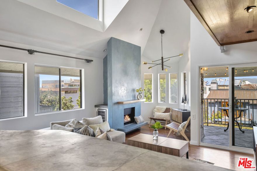 Are you dreaming of those long peaceful afternoons watching the boats sail in and out of the harbor? Let us introduce you to this spectacular 3-Story beach condo with Ocean and Mountain views situated in the most coveted Marina del Rey Peninsula. This spacious & bright contemporary condo just feels like a home featuring ultra-luxurious designer materials combining modern & warm natural elements throughout. The main level offers an open floor plan concept, with high ceiling, new light fixtures and natural light throughout. A dream chef's kitchen offering top of the line appliances and a custom design bar counter perfect for entertaining, opens to the dining room and living room spaces with a finish Venetian plaster fireplace and balcony overlooking the ocean and the quiet neighborhood. The levels are divided by unique designer stairs featuring sailboat stainless steel cable rigging. The lower level features a primary ensuite bedroom with it's private balcony, walk-in closet and bathroom, as well as a secondary bedroom, bathroom and laundry area. The top floor features a bright and spacious loft, ideal for a 3rd bedroom or office space with it's own private roof deck, perfect for your relaxing evening; you will enjoy the ocean breeze, tranquility and most spectacular sunset views. Secured small private building, with direct access gated garage. Abundance of built-in storage throughout the home. Located on a quiet walkway that will lead you to the sand and to the end of the Peninsula, where you can watch the boats pass. Close to all shopping, restaurants and all the amenities Marina del Rey has to offer. A perfect home gateway!