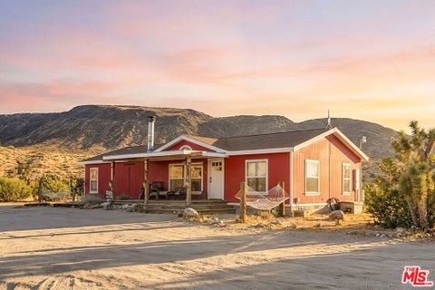 Photo of 55616 Pipes Canyon Road, Yucca Valley, CA 92284 (MLS # 26934549)