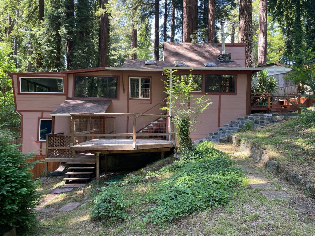 Nestled in the quaint town of La Honda this 2 Bed 2 Bath home shy of 1/4 acre w/lush landscaping + magnificent Redwoods has 2 levels. Currently 2 separate units--reinstall staircase to expand main living area.Main level has 1 bedroom with a versatile loft, an extra room w/closet could be a 2nd bedroom, 3/4 bath, and pass-thru kitchen that has a redwood breakfast bar. A free standing wood-burning stove situated in the open beam living room keeps you cozy on winter evenings.Skylights highlight the main living area.Downstairs consists of a studio with a separate entrance, kitchenette, and full bath. The back boundary borders the lovely picnic grounds of "Play Bowl" with a full access gate.It's part of Cuesta La Honda Guild.This is a large open area for picnicking, along with hiking trails through the redwood forest for everyone that lives in Cuesta.You are footsteps away to the the babbling creek where there is a secluded beach you can unwind as you sit and relax during the spring, summer, and fall ! The Cuesta LH Guild also offers a tennis court, equestrian ring, and a seasonal community pool at the clubhouse.Don't forget Reflection Lake ! A great community !! 15 minutes to sunsets at the ocean !County records differ from actual beds, bath,and square footage. Buyer to investigate-