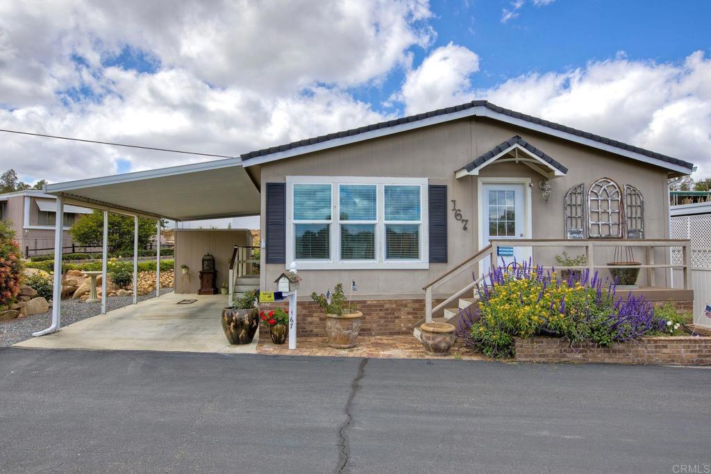 BEAUTIFUL 2004 FLEETWOOD MANUFACTURED HOME!! You will be amazed and delighted to see this very rare 3 Bedroom home for Hide Away Lake Mobile Estates. 3 bedrooms, 2 bath, totally updated home. 1280 esf, offered for $269,000. This home sits in Hide Away Lake Mobile Home Estates, a Senior Community 55+ that is located in beautiful Valley Center. The park is well maintained and a gated community. It features a nice rain-fed lake, community pool, clubhouse with billiards and exercise area, and a community laundry room. This home is in a great location; you can sit at the table and look at the lake while eating. This lovely home has blooming flowers all around the outside and sits just across the street from the Clubhouse and the lake. Please come and see this picture-perfect home soon, it will sell quickly!! The current space rent is $827.00 monthly.