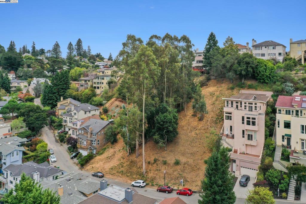 Imagine the possibilities at 209 Sheridan Road in vibrant Upper Rockridge. This expansive 6,000-square-foot vacant lot offers a rare opportunity to create your dream home with stunning valley views as your daily backdrop. The property comes with building plans, making the process of bringing your vision to life even more realistic. Imagine designing a space that perfectly suits your lifestyle, all while enjoying the beauty and serenity of the surrounding landscape. Whether you're an aspiring architect or simply looking for a canvas to craft your personalized sanctuary, this lot provides the perfect opportunity to create your dream home. Don't miss your chance to own a piece of Oakland with breathtaking views and endless potential. Your dream home starts here!