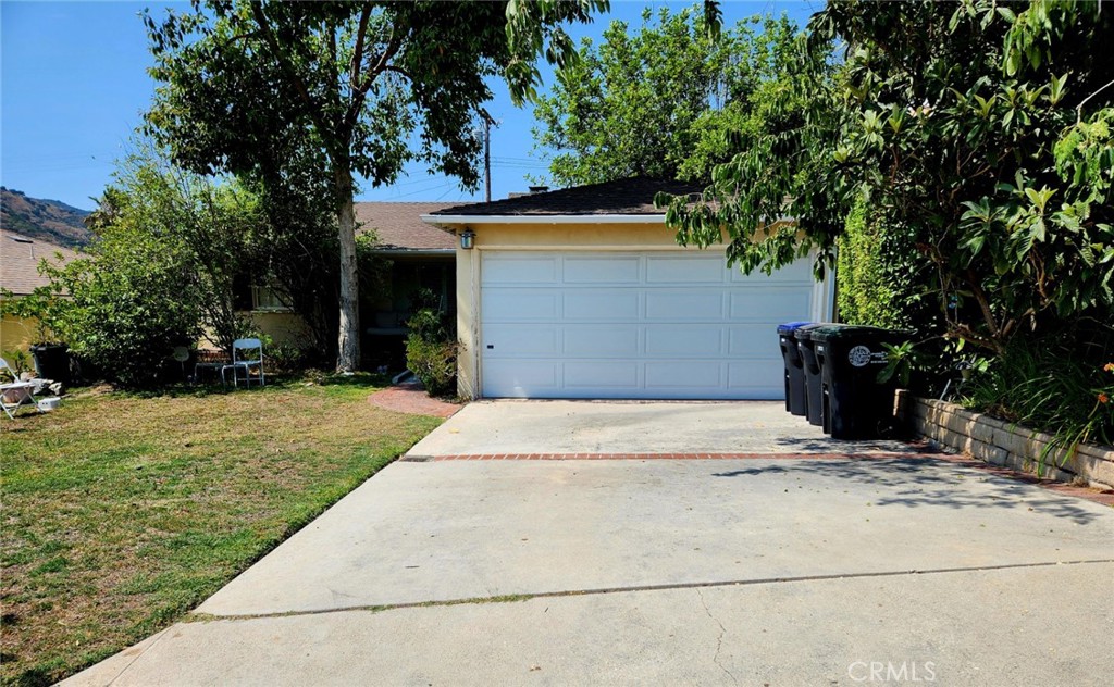 Located at 1823 Hillside Dr, this well-maintained 2 bedroom, 1 bath home features wood and tile flooring throughout, with a spacious dining room highlighted by a chandelier. The master bedroom includes an ensuite bathroom with dual sinks, a shower, and a bathtub. There’s a third additional bonus room with a closet, perfect for an office or extra bedroom, an additional 1/2 bathroom, an individual laundry room, plus a decent-sized finished California basement with potential for storage or other uses. Outside, enjoy a **pizza oven** Pool, and **hot tub**Speaker Rocks with a bedroom control—ideal for outdoor entertaining. The property also includes a ramp at the entry and back yard providing added accessibility. Conveniently located near popular shopping centers such as the Americana at Brand, local restaurants, the country club, and top-rated Glendale schools, this home strikes the perfect balance of comfort and convenience.