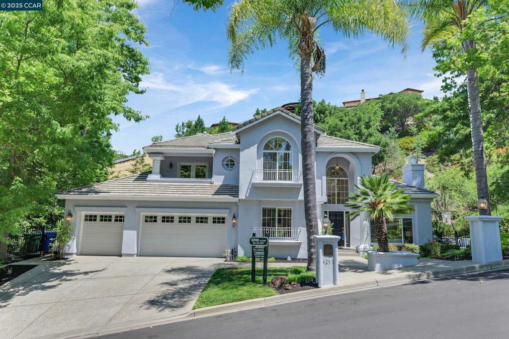 This beautiful, newer custom home is nestled in the heart of exclusive, guard-gated Blackhawk Country Club and offers the perfect balance of luxury, comfort, and sophistication. This gorgeous home with stunning curb appeal, sits on a quiet cul-de-sac and features timeless architecture and manicured landscaping. Step inside to soaring ceilings, rich hardwood floors, and an abundance of natural light that flows through expansive windows. The formal living and dining room have French doors that open to the spectacular backyard. Upgraded gourmet kitchen complete with quartz counters, custom cabinetry, center island and breakfast nook. The adjacent family room features a cozy fireplace and opens to a Sunroom and private backyard oasis, ideal for indoor-outdoor living. Lower level bedroom and attached full bath is great for guests. Office/5th bedroom plus powder bath on main level. Luxurious primary suite with spectacular views from balcony, spa like bath, soaking tub, dual vanities and huge walk in closet 2 addt'l upstairs beds with fabulous views share a bath. Backyard w/tropical pool, waterfalls, spa, sports ct., BBQ center perfect for outdoor entertaining. Near 2 championship golf courses, tennis/pickleball courts, fitness center, sports complex, pool and top-rated SRVUSD schools.