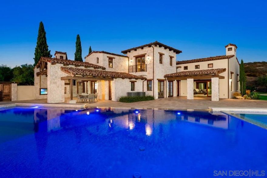 A rare opportunity to own a private Italian-inspired villa, extensively remodeled to blend modern luxury with timeless Tuscan elegance. This exceptional home in one of San Diego’s most exclusive gated golf communities offers unparalleled panoramic ocean and sunset views, complete privacy, and expansive living spaces ideal for entertaining.  Seamlessly connect indoor and outdoor living through disappearing glass doors opening to covered patios overlooking a sparkling vanishing-edge pool and beautifully landscaped grounds. Features include a convenient elevator, separate guest casita, and dedicated movie theater. The primary living area spans one level, complemented by a stunning circular staircase leading to an upper office with breathtaking ocean views and a versatile lower level perfect for a playroom, wine cellar, or personal retreat.  Set atop the coveted Santaluz community, enjoy access to the Rees Jones-designed golf course, 2,000+ acres of open space, scenic trails, and two exclusive clubs offering dining, fitness, spa, and tennis amenities. Centrally located near I-15 and I-5, this extraordinary property offers the ultimate Southern California lifestyle with sophistication, charm, and convenience.