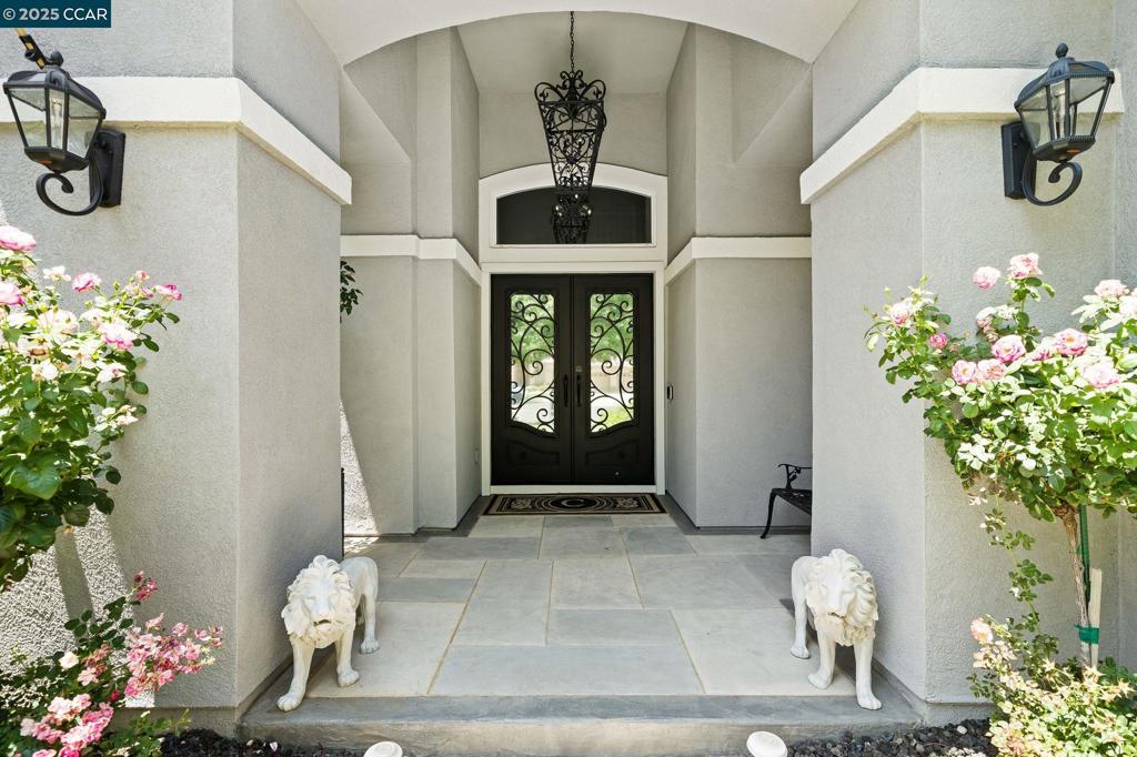 This one will steal your heart before you even step inside! Luxury, Location, and Lifestyle—All in One Brentwood Beauty! Welcome to Tuscany, where elegance meets everyday comfort. Tucked away on a quiet Brentwood court, this 3,247 sq ft home blends luxury design with a flexible floor plan. A custom wrought iron entry sets the tone for soaring ceilings, crown molding, two fireplaces, and designer lighting. The chef’s kitchen is a true centerpiece with a Viking 6-burner cooktop, French door oven, granite counters, marble backsplash, walk-in pantry, and oversized island—perfect for gatherings. With 5 bedrooms and 3 full baths, including a downstairs suite, the layout adapts to multigenerational living, guests, or a private office. Upstairs, the primary retreat features a spa-style bath, dual vanities, and an expansive walk-in closet, while secondary bedrooms are generously sized, most with walk-ins. Outdoors, enjoy manicured landscaping, fruit trees, raised veggie beds, two covered patios with updated awnings, a Canadian shed, and fresh fencing. The finished 3-car garage offers custom cabinetry, RV/side yard access, and a stamped driveway. Luxury, privacy, and convenience all come together in one exceptional home.