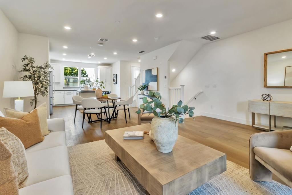Stunning 3-Bed, 3.5-Bath Townhouse in Prime Mountain View! Nestled in a peaceful community, this home is just steps from top-rated schools, scenic parks, and the vibrant San Antonio shopping and entertainment district. Downtown Mountain View, Caltrain/Light Rail, and the beloved weekly farmers market are only minutes awaymaking the location truly unbeatable. This beautifully appointed three-story townhouse features soaring ceilings, recessed lighting, dual-pane windows, and a bright open layout. The gourmet kitchen boasts an oversized island, granite counters, upgraded stainless steel appliances, and abundant cabinetry, flowing seamlessly into a light-filled living area with a private balcony. Each bedroom includes its own full bath - the primary suite offering a spa-like retreat with dual sinks, oversized shower, soaking tub, and huge walk-in closet. A first-floor in-law/guest suite adds flexibility for an office or visitors. Additional highlights include engineered wood flooring throughout, a side-by-side two-car garage, pre-wired EV charging, a wraparound patio, and ample storage. Ideally located near schools, parks, shopping, dining, and top tech employers such as Google, Meta, LinkedIn, and Apple. Luxury, location, and lifestyle - this one has it all and will go fast!