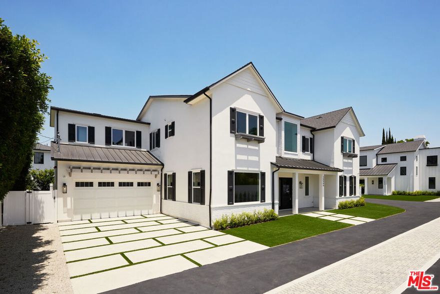 This elegant gated contemporary 2024 new construction home boasts stunning architecture and luxurious finishes. This masterpiece is situated on its own secure access street with a private driveway. You are welcomed into this two-story home, with wood floors, high ceilings, and exquisite details throughout. The wide entry hall leads to a spacious formal dining room adorned with a wine display and a floating staircase.The designer kitchen is a chef's dream, featuring quartz countertops, a center island, and Thermador appliances. The inviting family room includes a fireplace and beautiful built-in cabinets, with oversized pocket sliding glass doors that open up to the remarkable backyard, perfect for seamless indoor/outdoor entertaining.Upstairs, the lavish primary retreat offers cathedral ceilings, a private balcony, a fireplace, an oversized closet, and a primary bathroom with a dual vanity, water closet, soaking tub, and a massive standing glass rain shower. Three additional upstairs bedrooms have ensuite baths, private balconies, and walk-in closets.The private entertainer's yard is a haven of relaxation and entertainment, featuring a sparkling pool and hot tub. Additional conveniences includeControl4 Home Automation, which has full control over theintegrated climate system, alarm, lights, pool, security cameras, and surround sound. This truly marvelous home is ideally located near the BLVD, close to fine dining, shopping, and more.