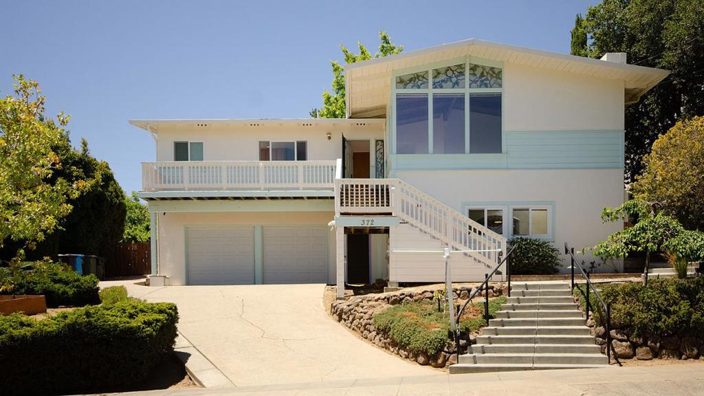Wonderful location for this 2 plus convertible den, 1 3/4 bath home with an ADU downstairs. Perfect opportunity for the right family. Lovely large and usable rear yard.