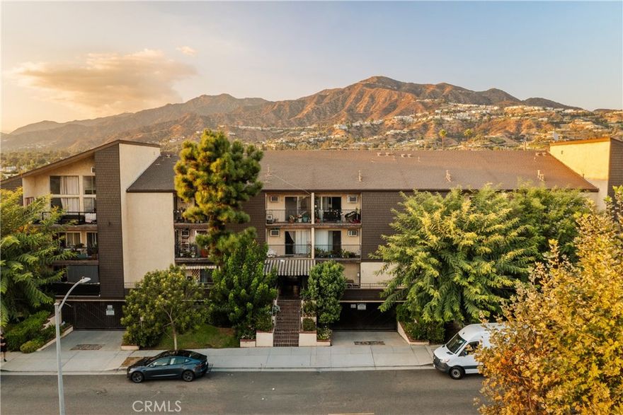 Experience the best of Glendale living in this move-in ready top-floor condominium. Vaulted ceilings and warm wood-tone flooring create a bright, open ambiance, while the spacious living area extends seamlessly to a covered balcony—perfect for morning coffee or evening relaxation. The dining area flows into the updated kitchen, featuring stainless steel appliances and quartz countertops. The primary suite offers dual closets, and the renovated bathroom boasts dual sinks and a modern shower. Freshly painted with a large walk-in storage closet inside the unit, this home blends comfort, style, and convenience. Community amenities include a sparkling pool and spa, BBQ area, inviting courtyard, recreation room, and community laundry. Additional highlights include an assigned parking space, a secure storage cabinet in the subterranean garage with elevator access, a resident garbage chute, and controlled entry for added peace of mind. Ideally located just moments from The Americana at Brand, with easy access to shopping, dining, entertainment, freeways, and public transit, this home offers both lifestyle and convenience.