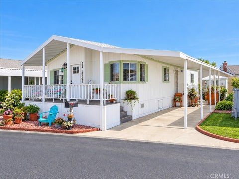 Photo of 16222 Monterey Lane Ln #51, Huntington Beach, CA 92649 (MLS # OC26224909)