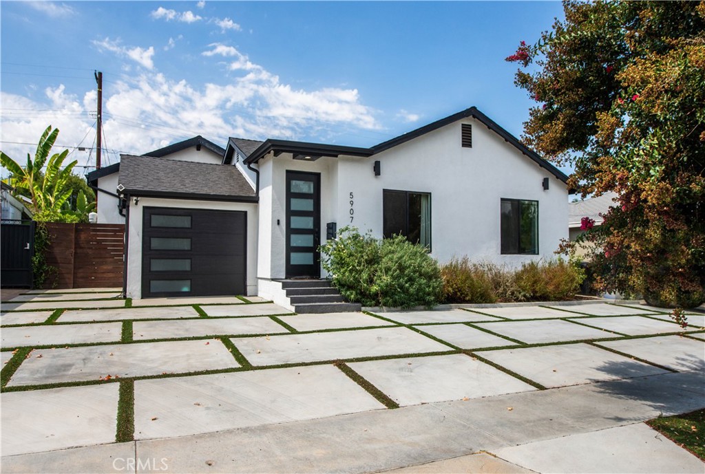 Stunning Remodeled Encino Park Home with Modern Upgrades and Energy Efficiency. Welcome to this beautifully remodeled and expanded 5-bedroom Encino Park gem, offering a seamless open floor plan flooded with natural light and highlighted by a striking exposed wood beam ceiling. From the moment you enter, you’ll be captivated by the expansive great room featuring wall-to-wall glass doors that open to a serene outdoor space. The chef’s kitchen is a showstopper — designed with quartz countertops, a spacious eat-in island with ample storage, soft-close white cabinetry, premium Thor stainless steel appliances, and a massive walk-in pantry for ultimate convenience. This home includes three generously sized bedrooms near the front of the house, accompanied by a large shared bathroom with double vanity. The luxurious primary suite is a private retreat with a walk-in closet, spa-like bathroom featuring an oversized shower, soaking tub, and dual sinks. An additional en-suite bedroom with its own walk-in closet and full bath adds flexibility for guests or extended family. Step outside to your private backyard oasis, complete with low-maintenance turf, a durable Trex deck perfect for entertaining, and lush landscaping. Enjoy energy efficiency year-round with fully owned solar panels and Tesla Powerwall batteries, keeping your electric bills low and your home powered even during outages. This move-in ready home blends comfort, luxury, and sustainability — don’t miss this rare opportunity in Encino Park!