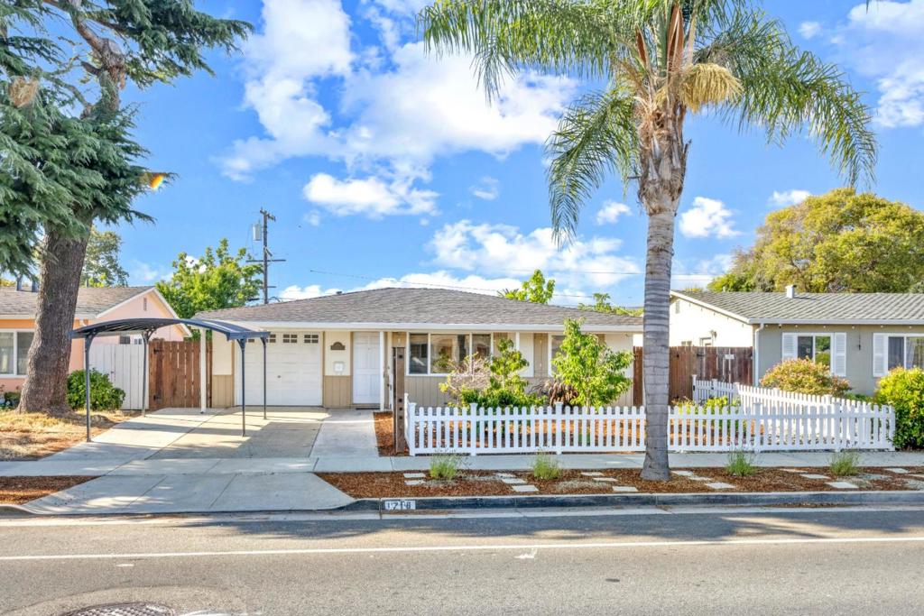 Welcome to your dream home at 1718 Foxworthy Avenue in beautiful San Jose! This charming single-family residence features 3 cozy bedrooms and a beautifully remodeled bathroom. With a spacious 1,060 square feet of living space and situated on a generous 5,000 square foot lot, this home offers ample room to relax and entertain. Step inside to discover a bright, open floor plan with gorgeous hardwood floors and freshly painted interiors. The modern kitchen boasts stainless steel appliances, making it perfect for culinary adventures. For added comfort, the home includes updated furnace and AC units, dual-pane windows, and a whole-house attic fan in the hallway. The outdoor space is a true retreat, featuring a shaded pergola, a large grass area, and a drought-resistant front yard, all maintained by an auto drip and sprinkler irrigation system. The backyard also includes fruit trees, a vegetable garden, and a handy storage shed. Additional amenities include a 1-car attached garage, a 1-car carport, and a stackable washer and dryer in the garage. Don't miss this gem!