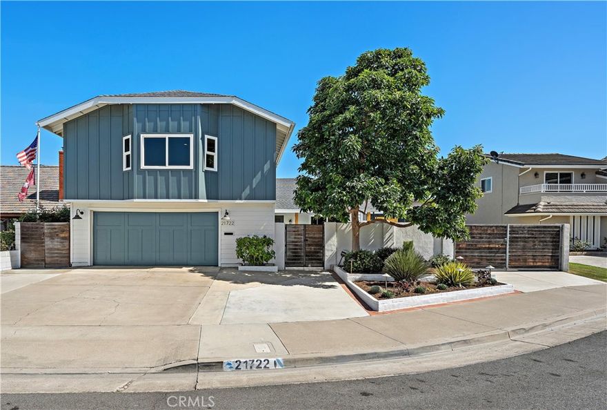 Situated at the end of a quiet cul-de-sac in the highly sought-after South of Hamilton pocket of Huntington Beach, this beautifully remodeled and upgraded residence offers the ideal blend of indoor-outdoor coastal living. From the moment you enter the gated, private courtyard with a tranquil fountain, you'll feel a sense of calm and privacy that sets this property apart. Step inside to an open concept floor plan featuring vaulted ceilings, abundant natural light, and a light and bright decor. A floor-to-ceiling marble fireplace surround anchors the spacious living area, creating a sophisticated focal point in your great room.The chef’s kitchen is a true showstopper, complete with white shaker cabinets, stainless steel appliances, quartz countertops, a large center island, and ample prep and storage space, ideal for hosting gatherings or enjoying quiet mornings at home. This home’s flexible floor plan includes two ground-floor bedrooms, including a spacious primary suite with retreat, two walk-in closets, and a spa-inspired en-suite bath with dual vanities. Upstairs, you’ll find two spacious additional bedrooms and a bath, offering plenty of space for family, guests, or a home office. Seamlessly extending your living space, the property has a beautiful California Room equipped with bi-fold windows, a fireplace and TV, creating a perfect year-round entertaining space. Step outside to your resort-style backyard, complete with a spa, outdoor shower, sink and food prep station, mature vegetation and optional RV / boat parking, all designed to elevate your coastal lifestyle. Just minutes from the beach, top-rated Eader Elementary, daily needs and Newport Beach / Costa Mesa.