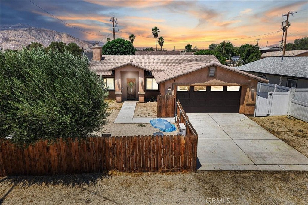 Welcome to this beautifully maintained single-story home located in the vibrant and growing community of Cabazon. This charming 3-bedroom, 2-bath residence features a bright and open floor plan, ideal for both comfortable everyday living and effortless entertaining. Enjoy stylish upgrades including neutral-toned luxury vinyl plank flooring, a modern barn door accent, and a convenient indoor laundry room. The spacious primary suite includes double sinks in the on-suite bath, offering both functionality and comfort. The fully fenced large backyard provides endless potential for outdoor enjoyment - and even a private pool. Conveniently situated near shopping, dining, near the Outlets and the Morongo Casino, with quick access to the I-10 freeway — this home is perfectly positioned for both convenience and lifestyle. Don’t miss this exceptional opportunity!