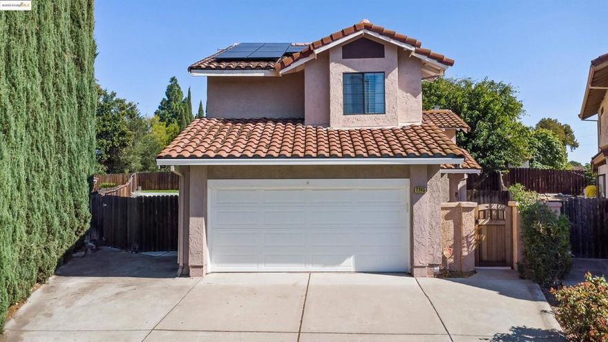 Welcome to this charming 3-bedroom, 2.5-bathroom home offering 1,422 sq. ft. of comfortable living space. Tucked away in a court location, this property features side yard access and a spacious backyard with an expansive patio—perfect for entertaining or relaxing outdoors. Inside, enjoy fresh interior paint, rich wood cabinetry, granite slab countertops, updated vinyl flooring, and carpet. The inviting family room features a cozy fireplace, ceiling fans, and recessed lighting. The home also includes an inside laundry room and an attached two-car garage. Energy-efficient living is yours with the owned solar system, helping reduce utility costs. Conveniently located close to major commute routes, shopping, and schools—this home offers both comfort and convenience.