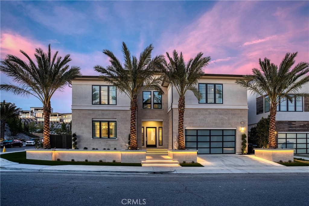 Nestled in the exclusive 24-hour guard gated community of Westcliffe in Porter Ranch. Stunning Modern Masterpiece with immaculate attention to detail attention. Through the impressive front door and into the foyer with it’s designer lighting and glass staircase. The spacious floorpan is perfect for entertaining on an intimate or grand scale. Pass through into the TRULY breathtaking Great Room flooded with natural light coming from it’s wall of windows. Soaring ceilings and luxurious oversized designer lighting from Restoration Hardware are truly impressive. Into the open kitchen which is equipped with a center island, gleaming quartz counters, a full suite of high-end stainless steel appliances. Conveniently located next to kitchen you will find a full wet bar. A study/library space is tucked into a quiet corner. Across the room multi-panel stacking grass doors that fold away and open to the outside. The architectural glass staircase takes you upstairs. Where you will find the Primary Suite which embodies spacious luxury. Designer finishes and fixtures throughout the sleeping area and adjacent sitting area. The en-suite bath is a perfect luxurious escape with all the designer high-end fixtures and finishes you would expect. Double vanity with quartz countertops with vessel sinks. A large walk-in shower stands next to the stand alone bath. Massive closet space with convenient access to the upstairs laundry room.Additionally, upstairs there are 3 en-suite bedrooms as well as a large flexible loft space.. This home allows you to enjoy the luxurious California indoor-outdoor lifestyle. Outside, in your manicured, easy to maintain yard you will find a very recently completed Pool, spa, fire pit and enormous outdoor kitchen with stainless-steel BBQ and gorgeous granite waterfall counters. The whole space is a cohesive, calming area with thoughtful design and luxurious appointments.all wrapped in gleaming stone and granite, Multiple entertaining spaces and standing at one end of the pool stands a show-stopping wall of water, fountain feature. This home has it all and is conveniently located close to award winning Sierra Canyon School as well as a access to the 118 freeway and the upscale Vineyard Shopping center which has shopping, dining and entertainment options. This is a special opportunity to live the lifestyle you deserve.