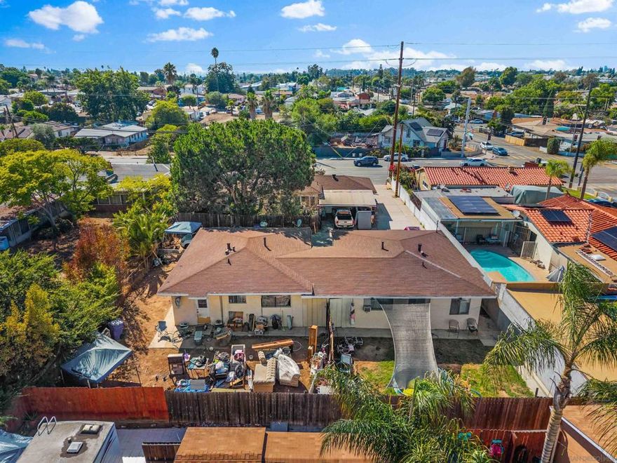 Discover a rare three-unit income property in the heart of Lemon Grove—completely free of HOA restrictions. All units are spacious 2-bedroom, 1-bathroom layouts, including a converted garage that creates valuable extra living space.  The main home sits at the front and currently rents for $2,500/month, while the two detached ADUs—each with its own address—bring in $2,100 and $2,200/month. With long-term tenants already in place on annual leases, investors benefit from immediate, stable cash flow from day one.  The main residence is a charming single-story home filled with natural light, original built-ins, and mature landscaping that offers both character and privacy. A fully fenced yard and functional layout enhance tenant livability and retention, while the property still provides upside through future cosmetic updates or repositioning.  Centrally located near freeways, shopping, and dining, this asset is ideal for an investor seeking reliable returns in a strong rental market—or for an owner-occupant who wants to live in one unit while offsetting their mortgage with steady rental income from the others.