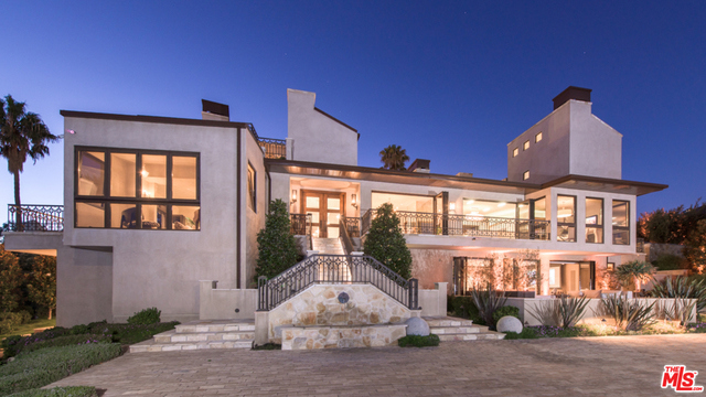 Just moments above PCH, this 6-acre plus private and secure compound offers breathtaking panoramic ocean views. This custom built masterpiece exudes an exceptional quality consistently showcased throughout the entire home. Designed with the finest materials and controlled by Crestron home automation, this property features an open floor plan with a spacious living room, library, theater, gourmet kitchen, gym, wine cellar and more. The master suite includes a sitting area, fireplace, exceptional coastline views, dual walk-in closets and a luxurious spa-like bath. The four guest bedrooms are generously proportioned and consist of en-suite bathrooms and walk in closets. This estate exhibits an extraordinary and serene setting with manicured grounds, a lighted tennis court, private pool, viewing decks, outdoor kitchen and pizza oven making this property perfect for entertaining. Accompanied with Malibu La Costa Beach Club rights make this complete package the ideal Malibu lifestyle.