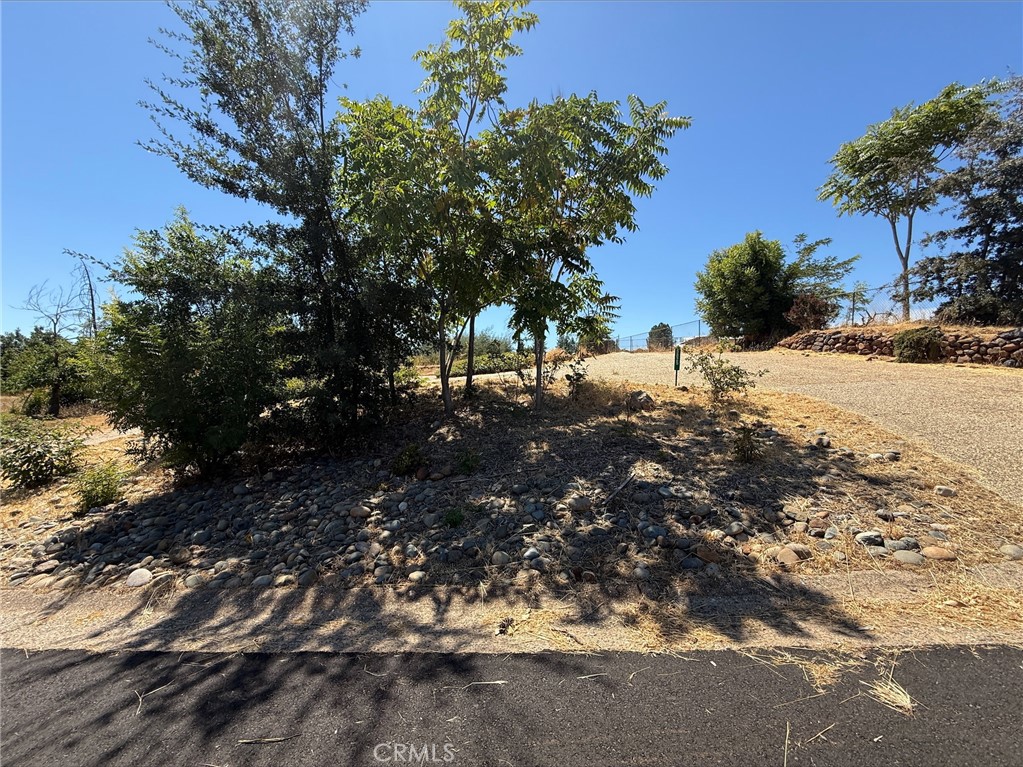 Discover the ideal canvas for your future home on this charming 0.25-acre lot, perfectly located in the heart of Paradise. Enjoy the convenience of nearby shopping, dining, and everyday amenities—all just minutes away. This property features a beautifully preserved exposed aggregate driveway and sits along a well-maintained, paved road in a peaceful neighborhood. Paradise Irrigation District (PID) water service has been maintained, offering reliable access to water. The lot previously housed a 2-bedroom, 2-bath home totaling 1,434 sq ft. Bring your vision to life and take advantage of this build-ready opportunity in one of Paradise’s most desirable locations!