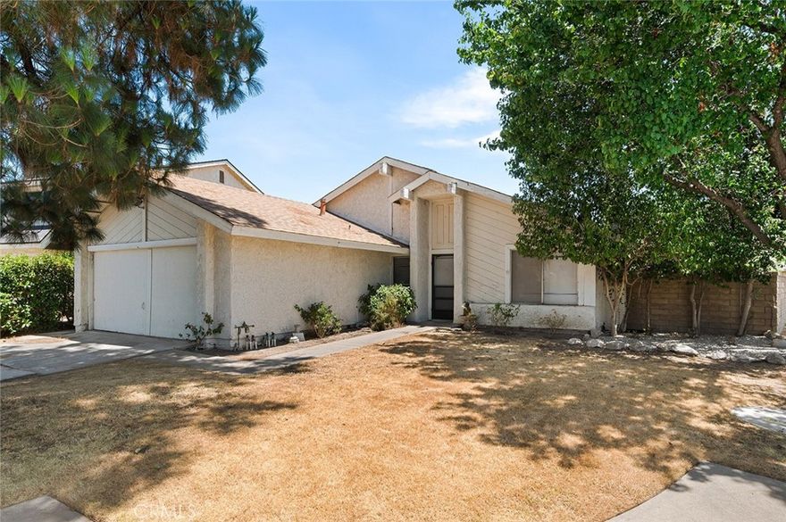 Welcome to 27502 Caraway Lane! This charming 4-bedroom, 2-bathroom home offers 1,400 sq ft of living space in the desirable Bouquet Canyon Hills community. With a smart layout and great natural light, this home is full of potential and ready for your personal touch. Enjoy a spacious living room featuring vaulted ceilings, light wood laminate flooring, and a cozy brick fireplace — perfect for creating warm, inviting gatherings. The kitchen is bright and functional, with ample cabinet storage, tile floors, and a large window that frames serene backyard views. Both bathrooms have been tastefully updated with modern tile and fixtures. The main bath includes a full tub and shower with a sleek glass door and striking tile accents. Each bedroom offers flexibility for sleeping, office, or guest space. Outside, you'll find a covered patio and a private backyard that’s ready for entertaining or relaxing under the California sun. This home is ideal for first-time buyers, investors, or anyone looking to create their dream home in a vibrant, amenity-rich neighborhood. Don’t miss this opportunity to own in one of Santa Clarita’s most accessible and community-oriented areas.