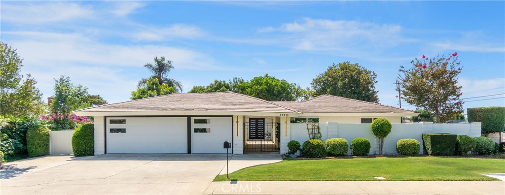 Welcome to 13511 Whembly Dr, a Beautifully and Extensively Renovated and Remodeled Single-Story Estate Nestled in one of North Tustin's most Desirable Neighborhoods. Boasting 4 Bedrooms, 3 Full Bathrooms, and approximately 2,200 Square Feet of Living Space, this Home Features a Functional Open Concept Floor Plan. The moment you enter, you're greeted by Rich Luxury Vinyl Flooring, and an Abundance of Natural Light Pouring Through all New Vinyl Windows and Sliding Doors. The Heart of the Home is found in the Expansive Chef’s Kitchen, complete with High-End Stainless Steel Appliances, Quartz Countertops, Modern Cabinetry, and a Large Center Island with a Waterfall Edge and Bar Seating. Adjacent to the Kitchen is a Warm and Open Family Room with a Cozy Fireplace and Direct Access to the Beautiful Backyard—Perfect for Indoor-Outdoor Living. The Spacious Primary Suite is a True Retreat with a Walk-in Closet, Ensuite Bathroom Featuring Two Vanities and a Glass-Enclosed Barn Door Shower. The Secondary Bedrooms are Generously sized and offer Flexibility for Home Office or Guest Use. Step outside to your Private Backyard Oasis, ideal for Entertaining or Relaxing. The Lush, Mature Landscaping Surrounds a Large Patio Space, Grassy Lawn, and Plenty of Room. With over 10,000 Square Feet of Flat Usable Lot, the Possibilities are Endless. Additional Features include: No Interior Steps, Indoor Laundry Room with Ample Storage, Central HVAC and new Energy-Star Windows, Oversized 3-Car Attached Garage with Direct Access and a Quiet, Interior Street with Minimal Traffic. Located in the Award-Winning Tustin Unified School District, near Foothill High School, Top-Rated Shopping, Dining, and just minutes to Freeways for an easy commute. Homes like this don’t come around often—Please Schedule your Private Tour Today!