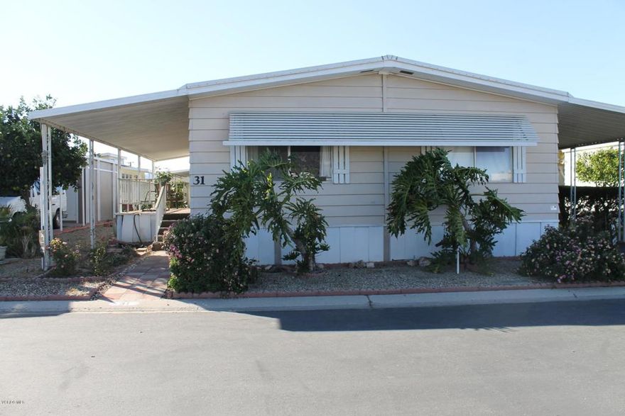 This very nice 2-bedroom + 2-bath home is located in the highly desirable Rancho Santa Paula Mobile Home Park (note:    Rancho Santa Paula is a senior (55+) community).   The home features a large master suite with a walk-in closet at one end of the home and 2nd guest bedroom and bath at the opposite end of the home.  There is also an enclosed patio room that could potentially be used as a home office or a hobby room.   This home is the perfect location for RV enthusiasts, as it home is very close to the park's RV parking area.  The sale of the home includes an outdoor storage shed, refrigerator, washer and dryer.  This professionally managed park has an RV parking area, a dog park, pool, spa, lovely clubhouse, billiard room, card room and lots of activities.