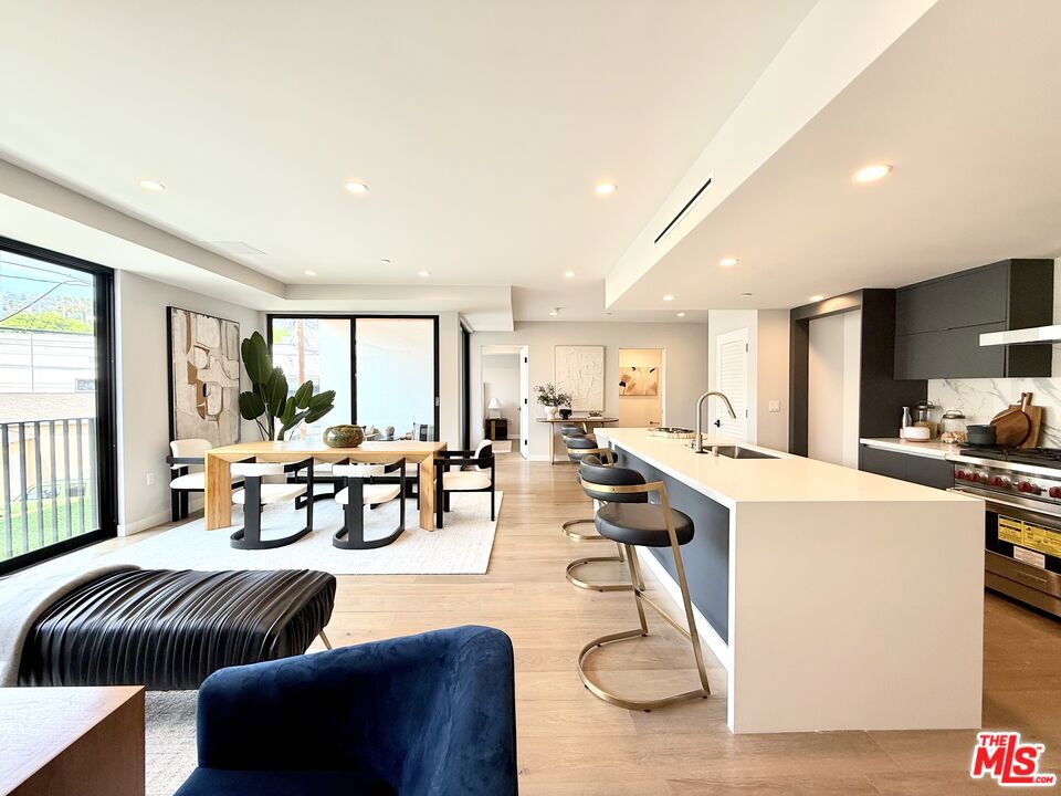 Located at 1017 N Croft Avenue, The Croft @ WeHo presents fresh, contemporary living central to the best of West Hollywood, offering a variety of floor plans ranging from spacious one-bedroom, one-bathroom residences to expansive three-bedroom, three-bath apartment homes. Crafted by Labyrinth Design Studio, each of these 16 eye-catching, modern residences is single-story, presents a patio or balcony and ranges from 800 to 2,220 square feet. Residences are spread throughout four levels, with a panoramic community rooftop deck highlighting exquisite views of the Los Angeles skyline and the Hollywood Hills.Interior design features include 8- to 12-foot ceiling heights, white oak engineered hardwood floors, abundant natural light and Nest doorbells. Primary bedrooms showcase built-in or walk-in closets and Fleetwood windows or pocket balcony doors. Spa-like bathrooms feature sleek tile-and-quartz finishes and Kohler fixtures. Contemporary culinary kitchens offer quartz countertops, porcelain backsplashes and Wolf and Sub-Zero appliances. Smart building security is built-in with Butterfly MX entry systems and parking allocation offers two tandem parking spots per residence, with bonus designated guest parking. This brand-new luxury building sits south of Santa Monica Boulevard, three short blocks north of Melrose Place and two blocks east of La Cienega. Enjoy proximity to all West Hollywood has to offer, from around-the-corner supermarkets like Gelson's and Sprouts to local restaurants and bars that include MelrosePlace, Catch Steak, Employees Only and Delilah. Boutique gyms abound nearby, including Equinox, F45 and Barry's. Please be advised that photos could be of alternate units.