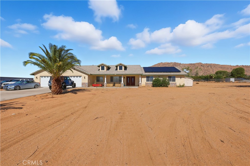 This is the one - Panoramic Valley Views in Sycamore Rock: Experience modern desert living in this stunning 4-bedroom, 3-bathroom home, built in 2002 and offering 2,994 sq. ft. of thoughtfully designed space on a sprawling 108,825 sq. ft. lot, just under 3 acres. Tucked away in a peaceful rural area of Apple Valley, this property provides the perfect blend of privacy and convenience.This property is ideal for those who love to entertain, store their toys, or simply enjoy the wide-open desert lifestyle. Don’t miss the opportunity to own this well-maintained property in a desirable location with room to grow and explore! 2 Master suites w/ private bathroom. Split floor plan. Oversized master w/ wet bar and fireplace on one end of the home. Walk in closets in 3 bedrooms. Fireplace in family room. Solar present. HWY 18 Sycamore Rocks Elementary School and Park is close by, along with Granite Hills High School. Amazing evening views from this property and instant desert access for all your off road adventures. Let's make this your new desert retreat today! Book your private tour!
