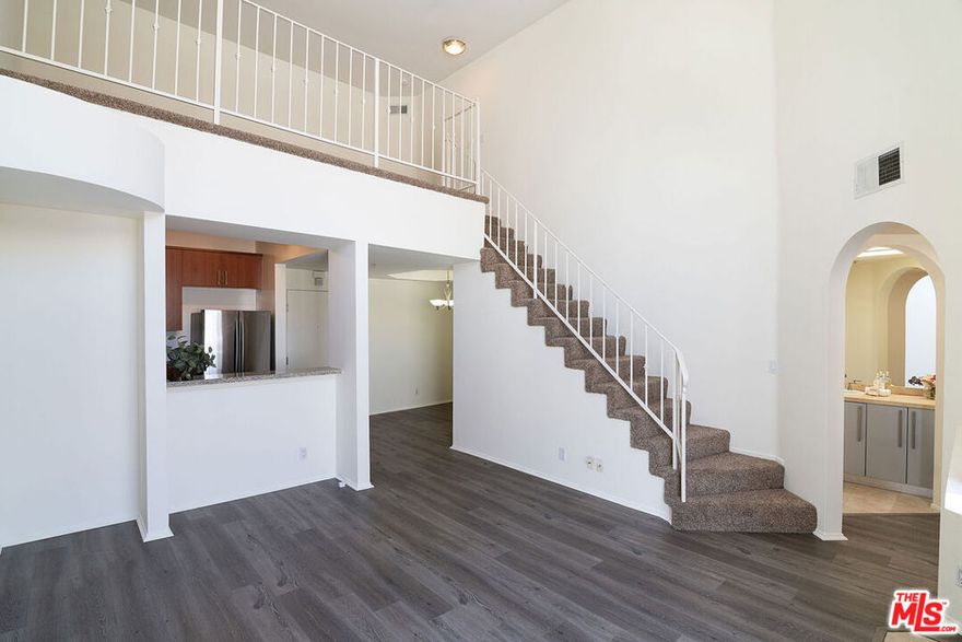 One Bedroom + Loft (can be used as 2nd bedroom).  The best and most secured condominium in the area.  24 hour on site security with surveillance cameras all around the building.  Secured garage gate access.  Rooftop pool, dry sauna, work out gym, and on site HOA manager.  Most popular unit within the building.  Community laundry is located on the same floor.  Two tandem (front and back) parking included.