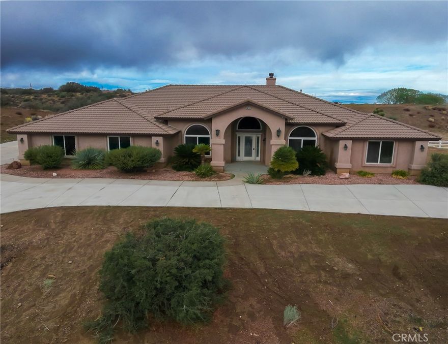 This home is located in the community of Oak Hills.  This home features 5 bedrooms 3 bathrooms.  Separate formal dining room and living room. This is an open concept layout.  The kitchen has a walk in pantry, breakfast nook and a fireplace in the corner.   Bedrooms are good size with plenty of closet space.  The primary bedroom is large with the bathroom attached with a full walk in closet.  Indoor laundry room with cabinets. The backyard is fenced with a covered patio and built in Bar-B-Que. A 3 car attached and another separate storage shed. Lot is 1.98 acres.