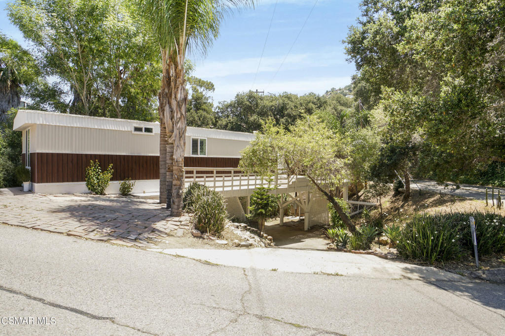 This 2-bedroom and 2-bathroom manufactured home has been recently renovated and is situated with an elevated foundation on a 7,405 sq.ft. lot. The manufactured home features newer interior vinyl-plank flooring throughout as well as newer interior and exterior paint providing an updated appearance inside and out. The kitchen includes quartz countertops, stainless steel appliances, and upgraded cabinetry. The open floor plan connects the kitchen to the living room area, providing a functional as well as efficient layout. The primary bedroom includes an en-suite bathroom with modern fixtures. As well as an additional bathroom with modern fixtures. Additional features for the manufactured home consist of a mini-split air conditioning system providing zoned temperature control, recessed lights, plantation window shutters, newer 200 amp electrical panel, skirting on the exterior of the manufactured home, wrap around balcony, additional separate balcony, and MORE!