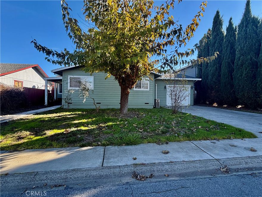 Welcome to 7332 Anchor Drive, located near the end of a quiet cul-de-sac in the desirable Highlands Harbor community—just moments from Cache Creek and Anderson Marsh. This 2-bedroom, 1.5-bathroom, 1,080 sq. ft. home, built in 1974, offers comfortable living spaces, canal-front access, and excellent potential for updates to make it truly shine. Interior Features: A spacious living room with wall-to-wall carpeting and a Mitsubishi ductless HVAC air handler for efficient heating and cooling. The kitchen includes tile countertops, wood cabinetry ready for fresh paint or repairs, an electric range/oven, and charming wainscoting on the walls. The hallway bathroom features linoleum tile flooring, a shower-over-tub, and a ceramic tile vanity. Both bedrooms are carpeted, with one offering an additional ductless wall air handler. A notable bonus is the one-car garage, which includes washer/dryer hookups and a convenient second bathroom complete with a shower. An additional air handler in the garage provides improved climate control.
The hot water heater is electric. Exterior & Yard: The home features green lap siding with white trim, dual-pane windows, and a concrete perimeter foundation. A sliding glass door off the living room opens to a covered back porch—perfect for relaxing or entertaining. The backyard is highlighted by a pergola accented with grapevines and direct canal-front access, complete with a private boat dock and foot ramp, offering quick access to the water.
The front yard includes a maintained lawn and attractive curb appeal.  Overall, the home is in good condition, with tremendous potential. With updated flooring and a fresh coat of interior paint, this home could be beautifully transformed and made uniquely your own. A wonderful opportunity to live in a waterfront community with great outdoor amenities and a peaceful setting.