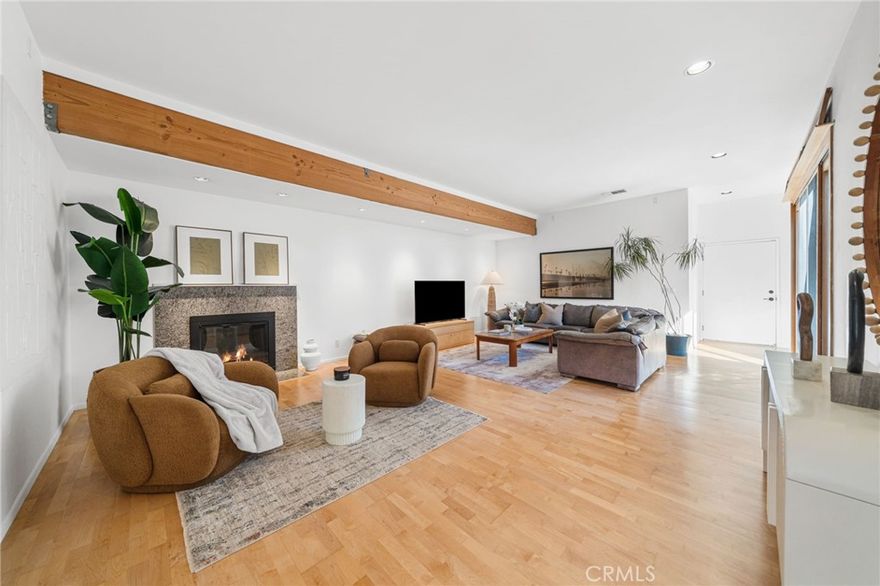 Welcome to 5862 Raphael Drive, Huntington Beach—a truly one-of-a-kind custom home on an inner-tract lot in a highly desirable neighborhood. Prepare to be surprised from the moment you step into this meticulously redesigned residence as it unexpectedly welcomes you with a spacious living room featuring 10-foot ceilings and engineered maple floors. A slider opens to a sunlit atrium where ocean breezes drift in from the Bolsa Chica Wetlands, filling the space with natural light and fresh air. The living area flows into the dining space and a chef’s dream kitchen, featuring a 6-burner Wolf range with separate warming oven, Sub-Zero refrigerator, Miele dishwasher, and a Franke farmhouse sink. A large 7-foot island, Blue Eyes granite countertops and backsplashes provide bold color contrast with the custom maple cabinetry. A temperature-controlled walk-in wine cellar sits just off the hall for effortless entertaining. Both bathrooms showcase Hansgrohe fixtures, granite sinks, and seamless granite slabs on the walls and counters. The hall bath has honed black slate flooring, an Aquatic hydrotherapy jet/air bath, and a large separate shower, with walls and countertops covered in Moon Night quartzite. The primary suite has limestone flooring, another oversized shower in Emerald Green quartzite, and another separate large deep jetted tub. For buyers who value a well-designed usable space, this home delivers: in addition to the standard 2-car garage, there is an extra 1.5-car bay perfect for a gym, workshop, or extra storage. Practical upgrades include a 200-amp electrical panel, all PVC drains, tankless Takagi water heater, and a concrete tile roof. Situated on an inner-tract lot, this home is minutes from acclaimed California schools, shopping, the Bolsa Chica Wetlands and trails, parks, Huntington Harbour, Meadowlark Golf Course, and the beaches of Huntington Beach. Don’t miss the opportunity to make this beautiful home yours.
