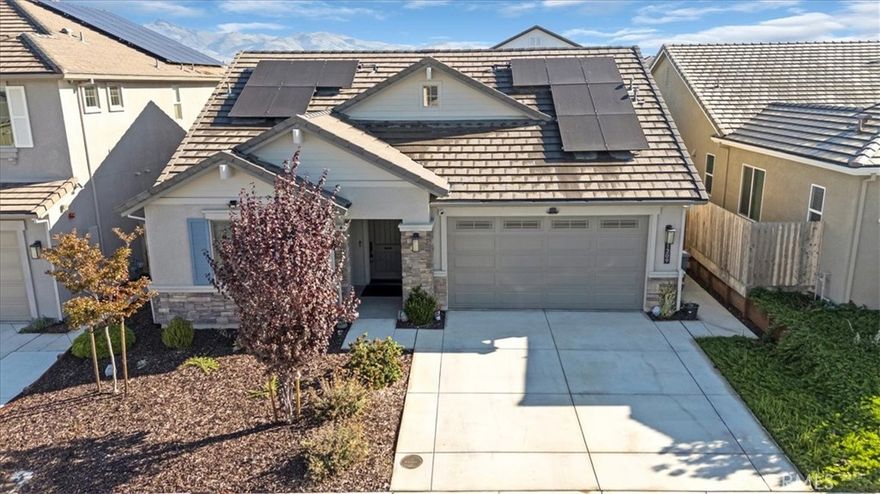 This completely upgraded single-story home offers modern style, thoughtful design, and an entertainer’s dream backyard. The open-concept living area features a spacious great room with abundant natural light, LVP flooring, and a seamless flow into the gourmet kitchen.  The kitchen boasts white shaker cabinets, sleek quartz countertops, stainless steel appliances, a subway tile backsplash, and an oversized island with bar seating—perfect for hosting and everyday living. Just off the side of the kitchen, you'll find a dedicated laundry room offering added convenience, extra storage, and easy access without disrupting the home's main living spaces. The luxurious primary suite includes a spa-inspired bathroom with a relaxing soaking tub, a spacious walk-in shower, and walk-in closet. Two additional bedrooms provide comfort and flexibility, ideal for family, guests, or a home office.
Step outside to your newly designed backyard oasis, complete with a full-length patio awning, roll-down privacy shades, low-maintenance turf, and an impressive outdoor kitchen setup, offering multiple built-in stainless steel appliances and extensive counter space. Whether relaxing or entertaining, this space is built to enjoy year-round. Additional features include upgraded lighting, custom window treatments, ample storage, and a clean, modern aesthetic throughout. Move-in ready and truly turnkey—this home combines comfort, luxury, and convenience in every detail. *Solar panels are leased, 12 panels* @ $97.73 per month