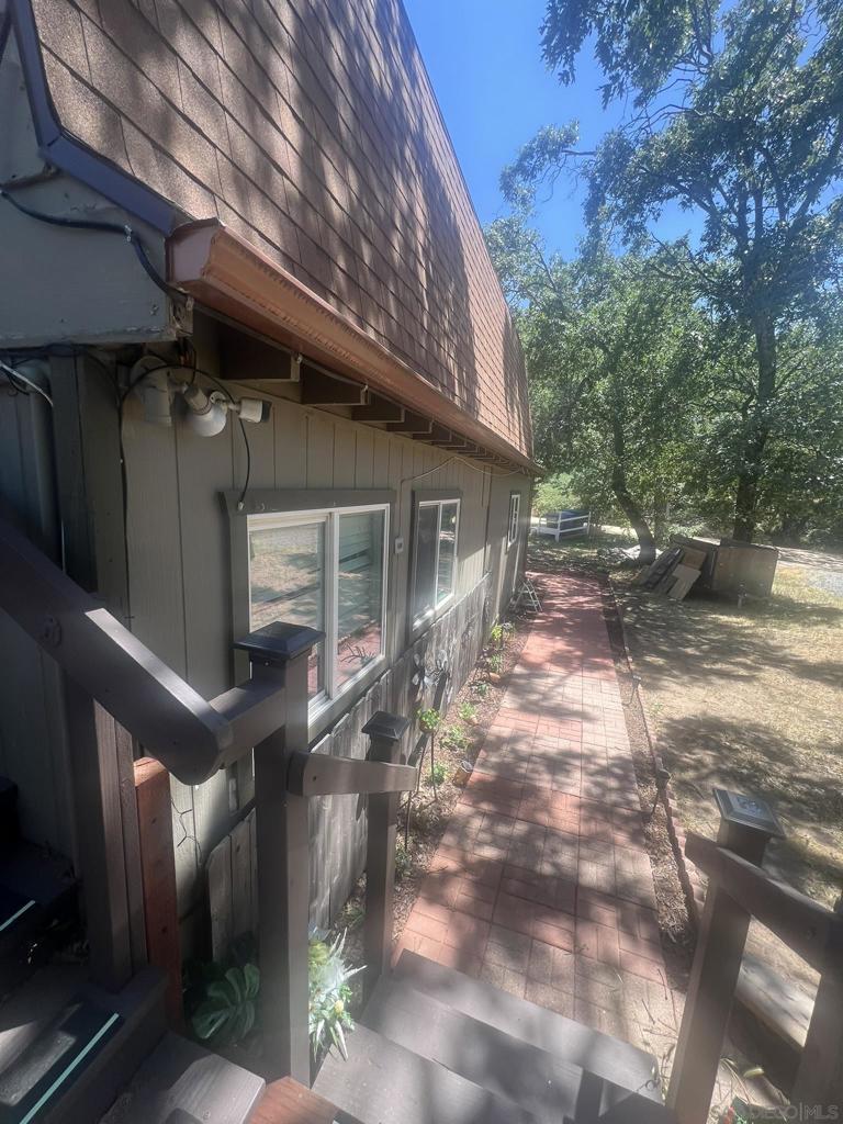 Escape to peace and privacy in this spacious, fully furnished studio apartment, just 2 miles from downtown Julian in the quiet, tree-lined Kentwood neighborhood. This 800 sq ft retreat offers a unique blend of comfort, convenience, and tranquility. Inside, you'll find hardwood floors throughout, a fully equipped kitchen with stove, refrigerator, and microwave, and a comfortable sleeping setup with a full-size bed and sleeper sofa. The updated clawfoot bathroom adds charm, while an in-unit dryer and cold-water washer provide added convenience. For year-round comfort, the unit includes electric heat and a portable A/C. A private entrance and driveway parking complete the offering. Rent includes electricity* (within reasonable usage), water, and trash service. Perfect for someone seeking a furnished, quiet rental just minutes from the historic townsite—this is a rare opportunity for secluded mountain living with all the essentials. Indoor cat allowed.