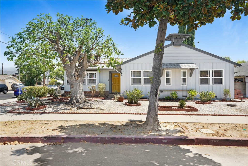 Welcome to your 3-bedroom, 2-bath home spanning an estimated 1,573 square feet, plus a versatile bonus room. Situated on a spacious lot, it offers a seamless blend of indoor comfort and outdoor living. It features a converted garage ideal for an accessory dwelling unit (ADU).
The interior welcomes you with warm wood floors flowing through an open floor plan. The kitchen boasts new cabinets, high-end stainless-steel appliances, a sleek range hood, and recessed lighting. Both bathrooms were fully renovated, and central air paired with ductless mini-splits ensures year-round comfort.
Outside, discover a fully paved backyard perfect for entertaining, low-maintenance, water-conserving landscaping, and an attached converted garage with generous storage and ADU potential.
Energy efficiency is a highlight, thanks to fully paid-off solar panels that significantly reduce utility costs. Street parking is abundant, and you’re just minutes from North Hollywood’s shopping—including Target and CVS—along with an eclectic mix of restaurants, cafés, and markets.