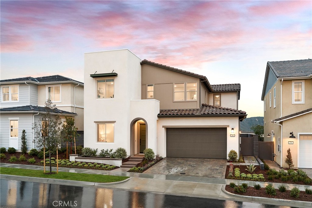 Experience the perfect blend of comfort and functionality at Lotus in Rancho Mission Viejo—Southern California’s premier single-family detached new home community!
Lotus Plan 2 offers approximately 3,057 sq. ft. of thoughtfully designed living space with 5 bedrooms, 3.5 bathrooms, a loft, Golf Cart space, and a 2-car garage.
This home features a downstairs bedroom and full bath with walk-in showerand bedroom with private sitting room. 10ft. Ceilings and a seperate large two car garage. This specific home, lot 24, includes upgraded kitchen cabinets to the ceiling, pot and pand drawers, quartz counter tops, full designer backsplash in the kitchen, upgraded primary bathroom suite, a fireplace in the great room, and upgraded electrical. Upstairs, the spacious primary suite includes a private sitting area, dual walk-in closets, and a spa-like bathroom with dual vanities. A versatile loft and well-planned layout make this home both elegant and functional.
Lot 24 will be ready for move-in August 2025—don’t miss the opportunity to own this exceptional home in Rancho Mission Viejo!
